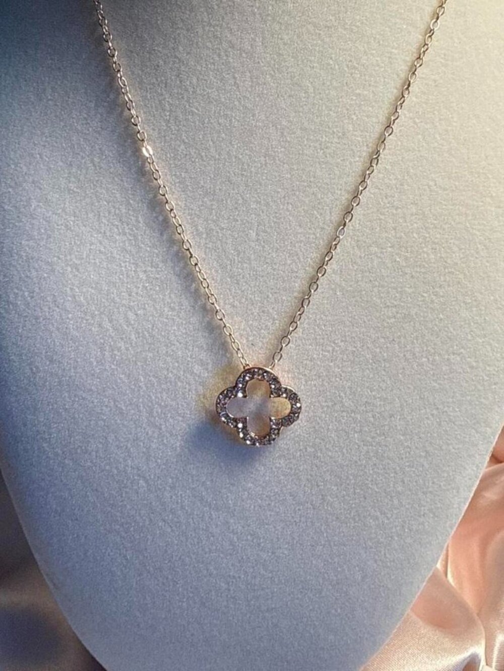 Gold & white crystal pendant necklace with four-leaf clover design